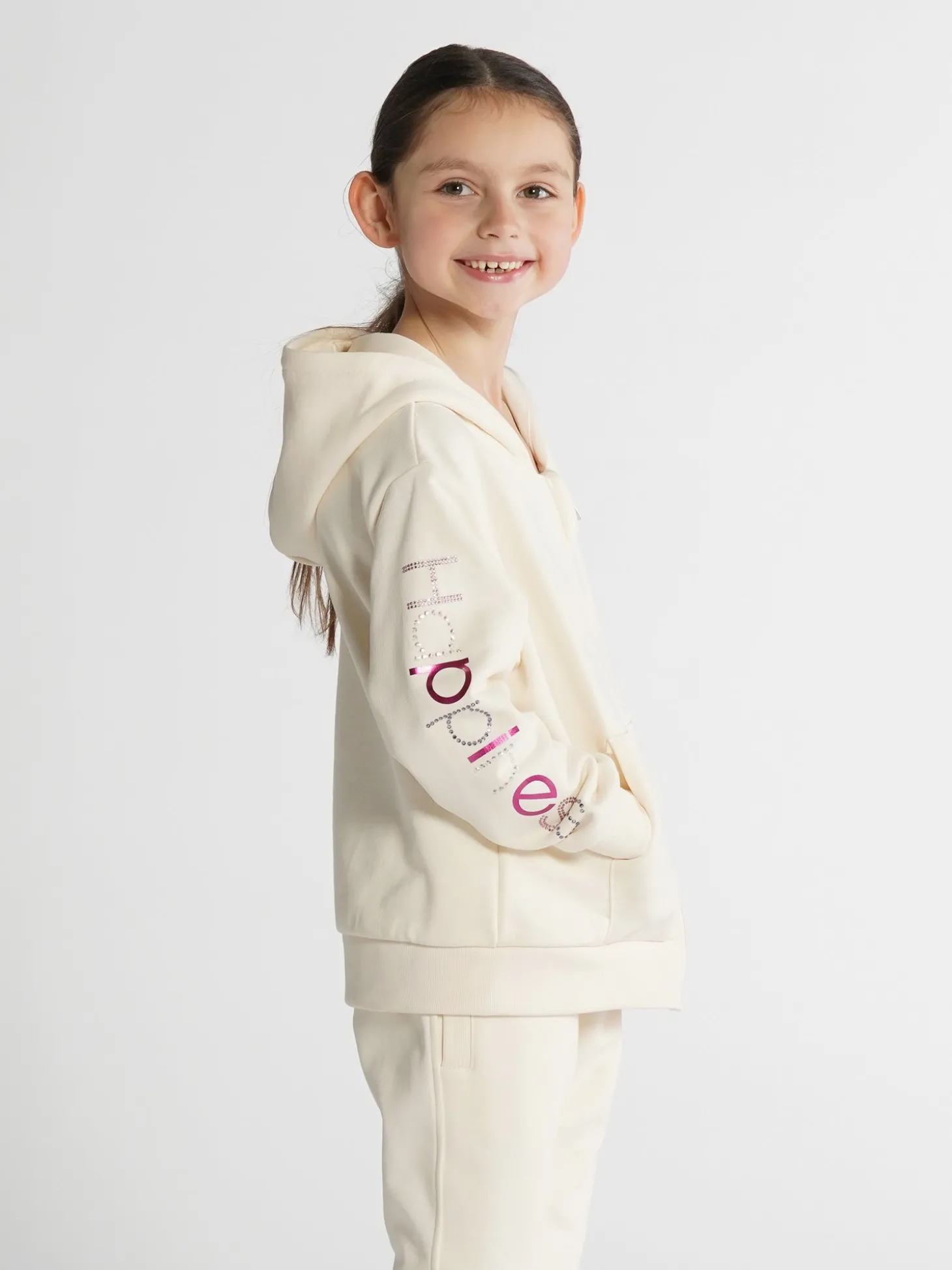 felpa_zip_bimba__happines_0-4.webp Felpa Zip Bimba - Happiness Strass multicolore e lamina fucsia 22F